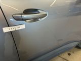 a sticker on the door handle of a car
