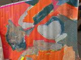 a picture of a painting hanging on a clothes line