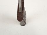 a close up of a metal object on a white surface