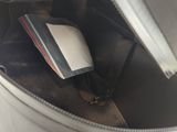 a bag with a cell phone inside of it
