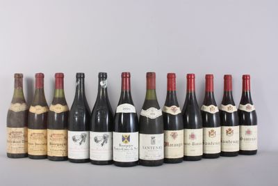 several bottles of wine are lined up on a table