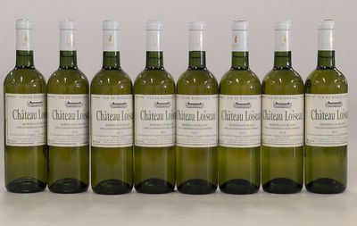 six bottles of white wine lined up in a row
