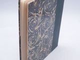 a book that is open on a white surface