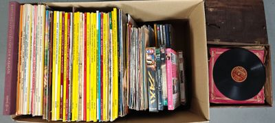 a box full of records and a record player
