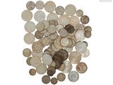 a pile of old coins on a white background