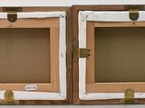 two wooden boxes that are sitting on a table