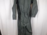 an image of a green rain suit hanging on a white curtain