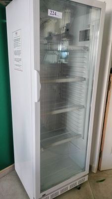 an image of a refrigerator in a room with a green wall