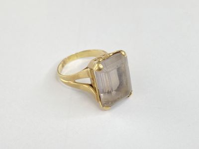 a close up of a ring with a stone on it