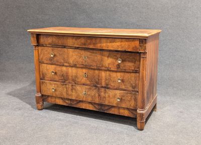 a wooden chest of drawers with three drawers on each side