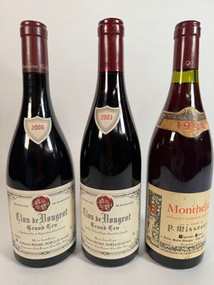 trois bouteilles de vin sont alignées sur une surface blanche