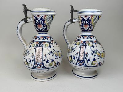 two vases that are sitting on a table