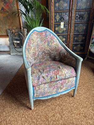 a chair that is sitting in the middle of a room