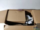 a cardboard box with a laptop inside of it