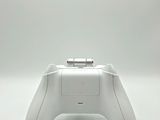 an image of a close up of a controller on a white surface