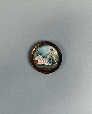 Scène galante, miniature peinte dans un cadre rond en métal.
