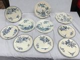 many plates that are sitting on a table