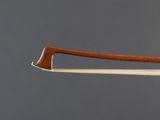 a close up of a violin bow with a wooden handle