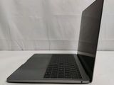 an open laptop computer sitting on top of a white table
