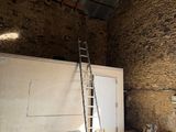 a ladder that is leaning against a wall in a building
