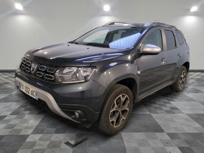 a picture of a grey dacia parked on a checkered floor