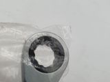 someone is holding a wrenet in a plastic bag on a white surface