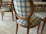 several chairs that are sitting in a room together
