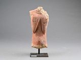 an image of a clay statue of a woman ' s head on a stand