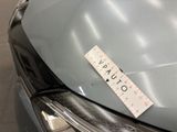 a sticker on the hood of a car that has a sticker on it
