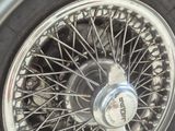 a close up of a car tire on the ground