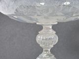 a glass bowl with a design on it on a table