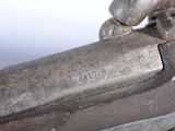 a close up of a gun that is on a table