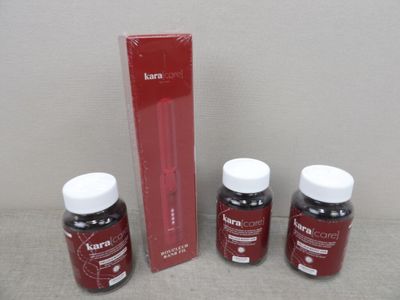 three bottles of red liquid sitting next to a red box