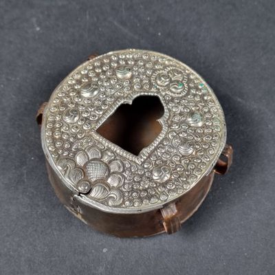a close up of a metal box with a heart shaped hole in it