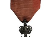 l'image d'une médaille surmontée d'une étoile