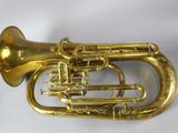 a brass instrument that is sitting on a table
