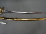 two swords that are on display on a table
