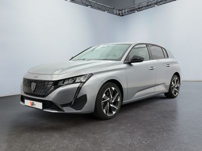 a silver car in a white room with a black floor