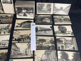 several old black and white photographs of a street and buildings