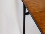 an image of a wooden table with black legs