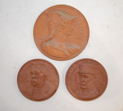 three different types of coins are shown on a white surface