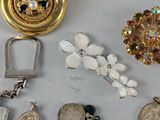 many different types of jewelry on the table