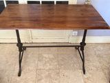 an image of a wooden table with metal legs