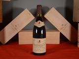 a bottle of wine that is sitting on a table
