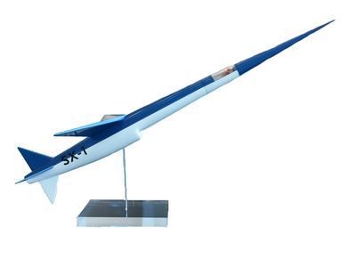 blue and white model of a space rocket on a stand