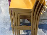 four chairs stacked on top of each other in a store