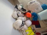 a pile of assorted items on the floor next to a wall
