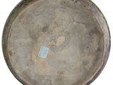 a large metal bowl with a tag on it