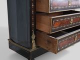 a chest of drawers that has a mirror on top of it
