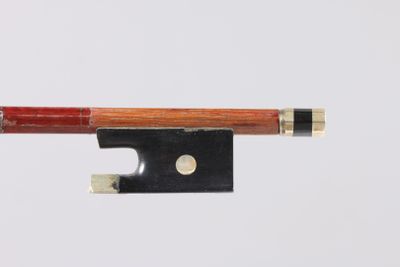 a close up of a violin bow on a white background